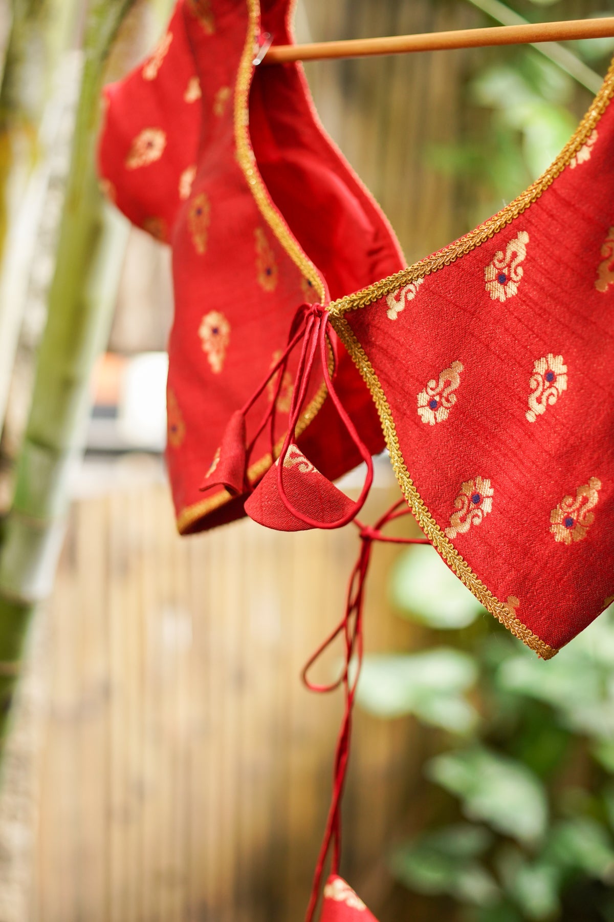 Red brocade with gold motif deep V neck blouse