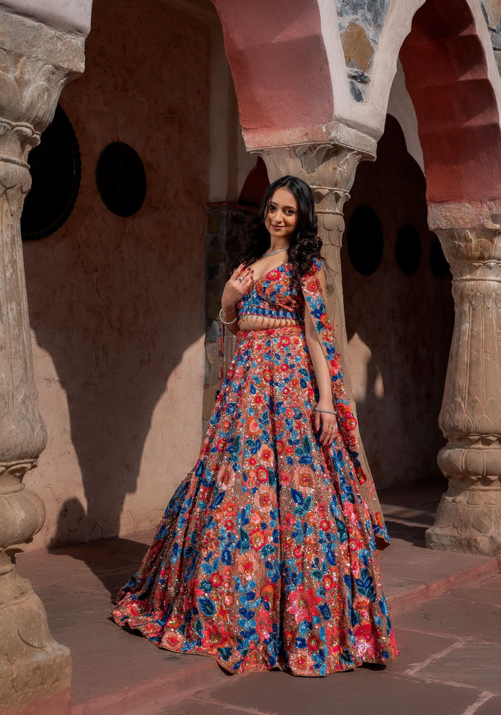 Dazzling Wildflower Lehenga with hand-embroidery in Net in Rust and Blue, Customizable, Made to Order