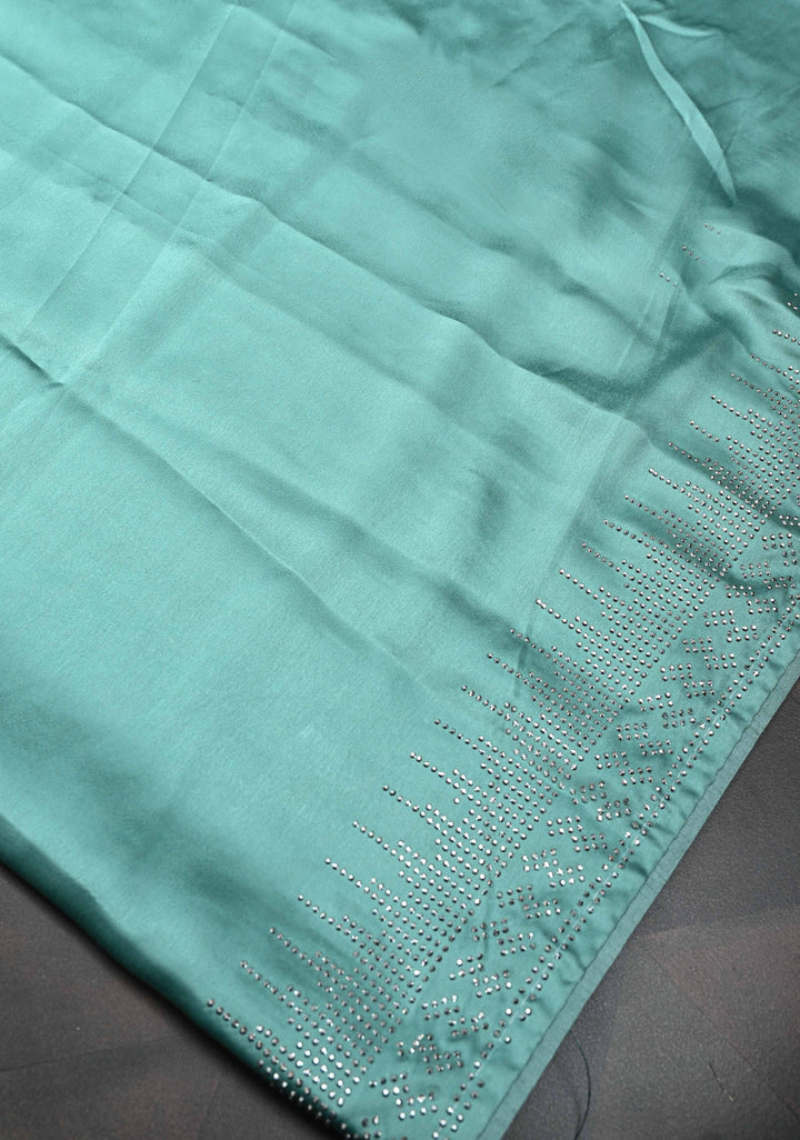 Mint Green Satin Saree with Tone on Tone Powder Stones