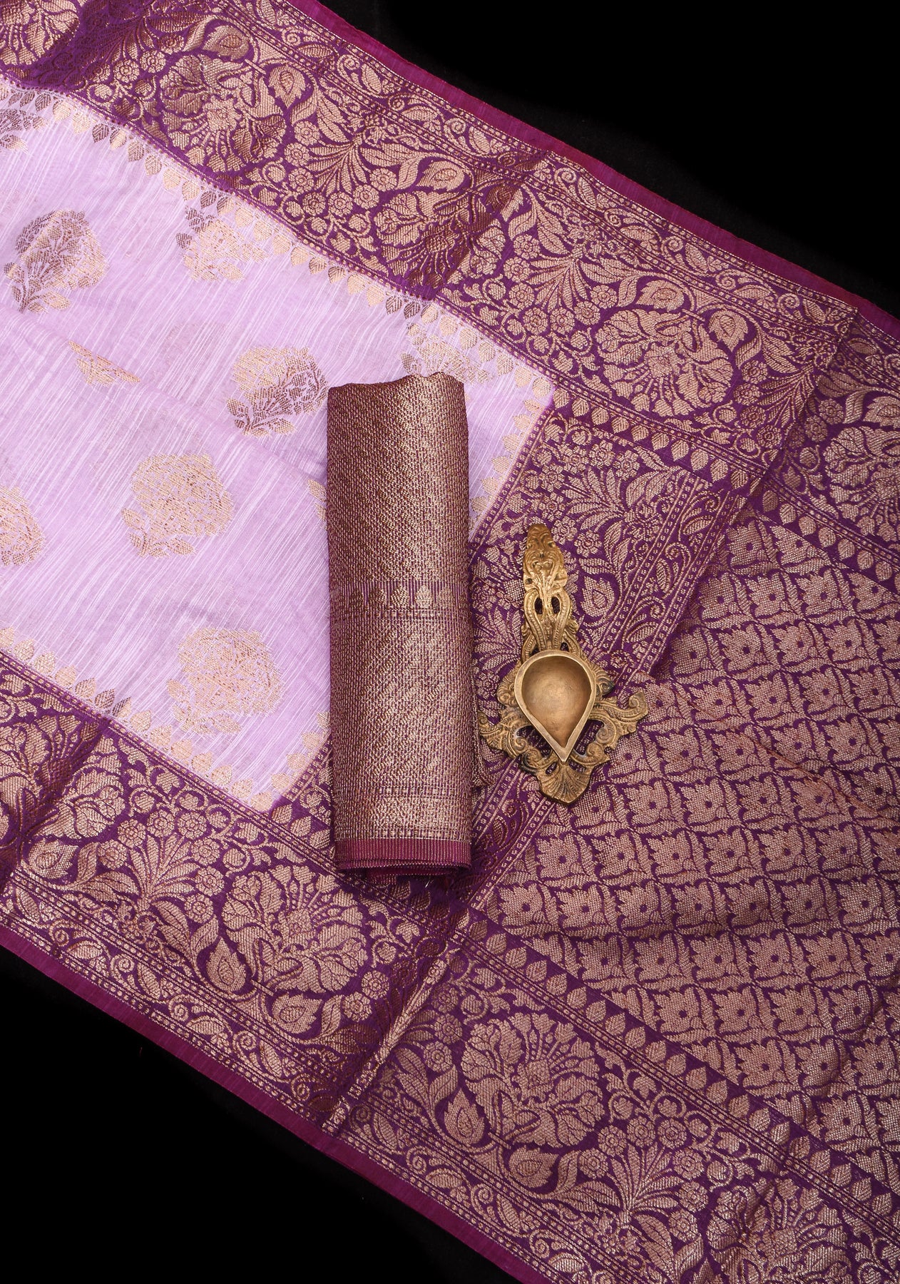 Lilac floral linen saree with woven zari borders