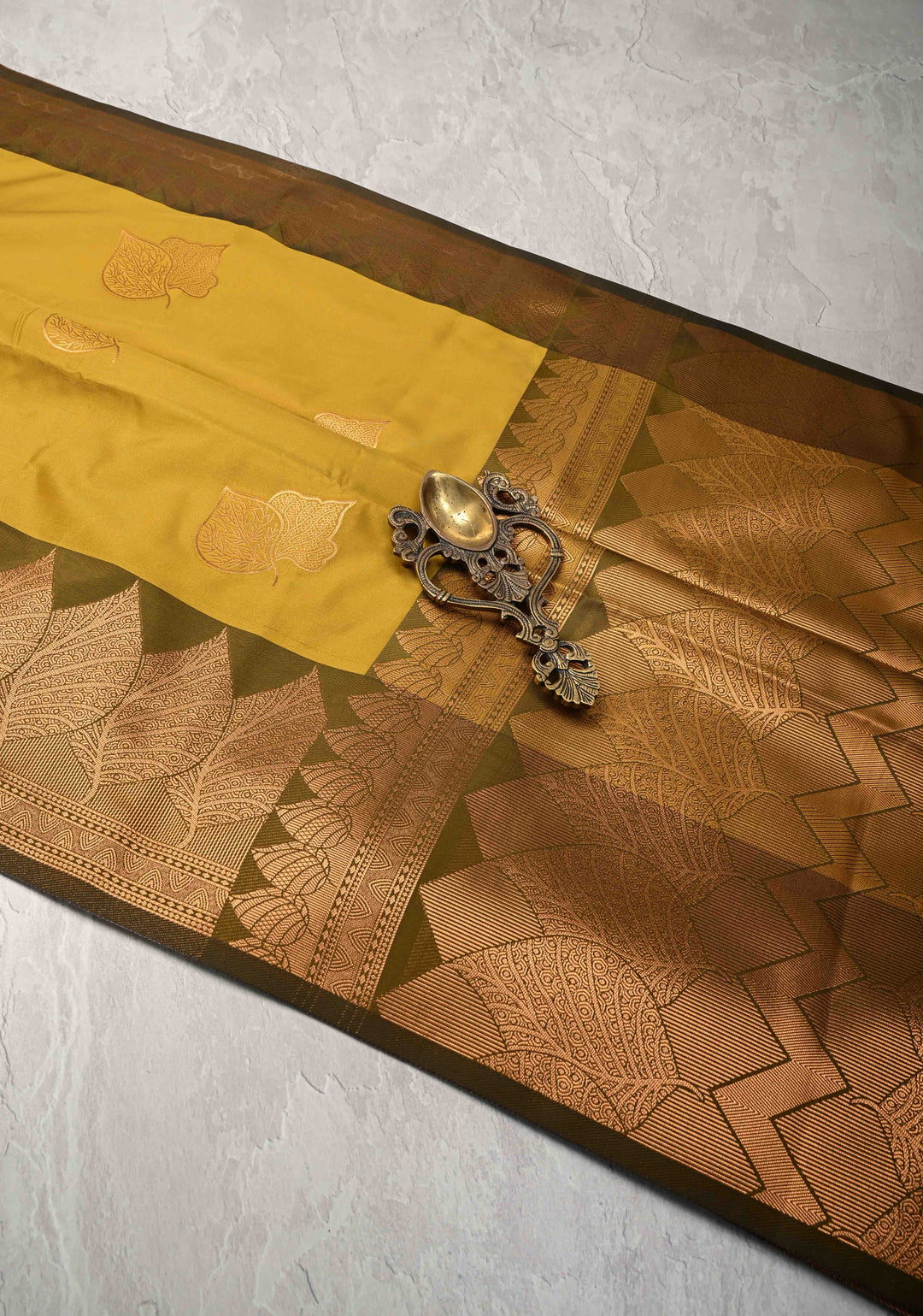 Moss Green Kanchi Semi Silk Saree with Leaf Buttas and Zari Border