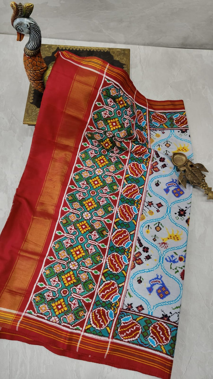 Gray Patan Patola double ikkat silk saree with Trellis Pattern flora and fauna Theme | SILK MARK CERTIFIED